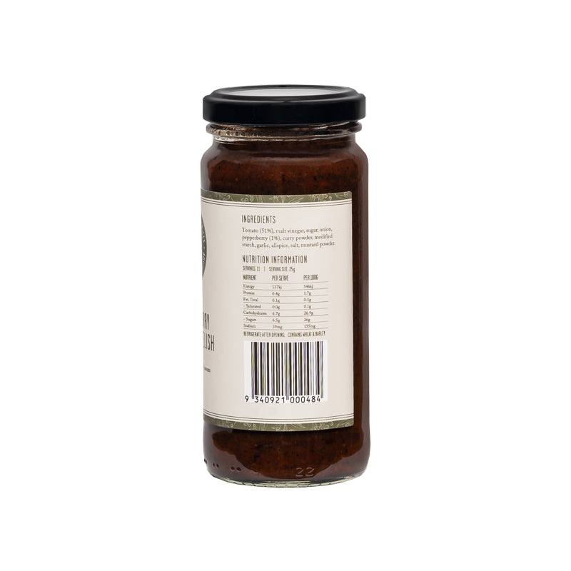 Jar of Pepperberry Tomato Relish with fresh tomatoes and pepperberry on wooden background
